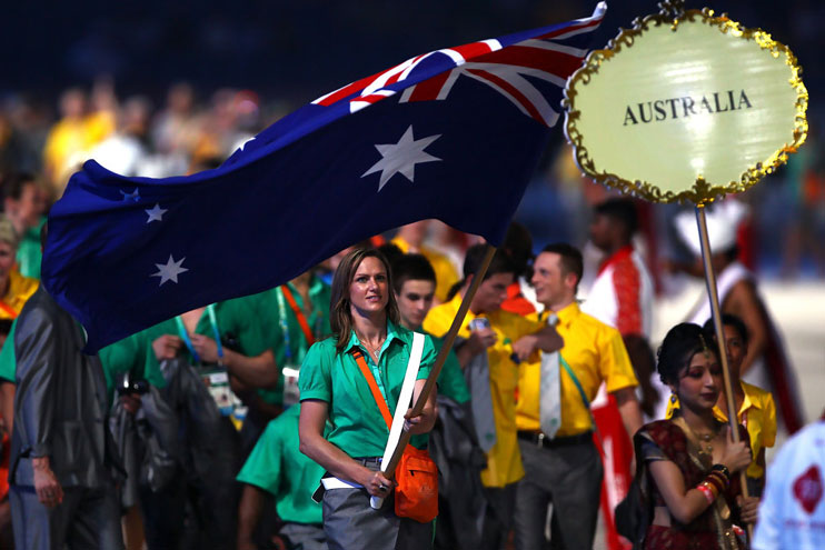 Sharelle McMahon carrying the flag at the 2010 Delhi Commonwealth Games Opening Ceremony