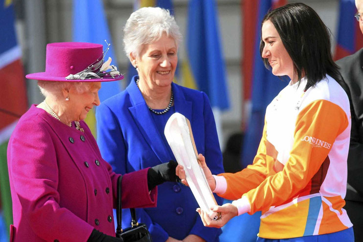 Anna Meares receiving the baton from Queen Elizabeth II