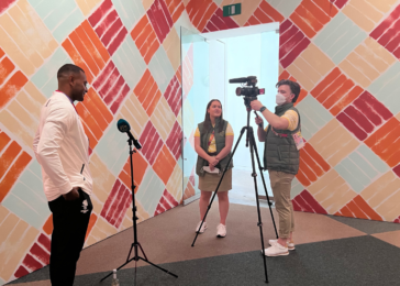 Madeleine Barras, Commonwealth Games Australia intern, assists with interviewing athlete
