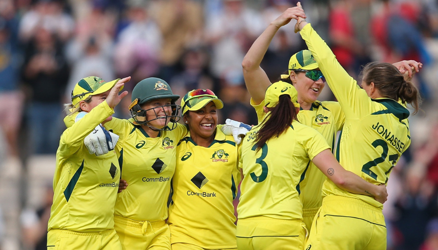 The Australian Women's Cricket Team celebrates after a win over England, securing the Ashes trophy in the process